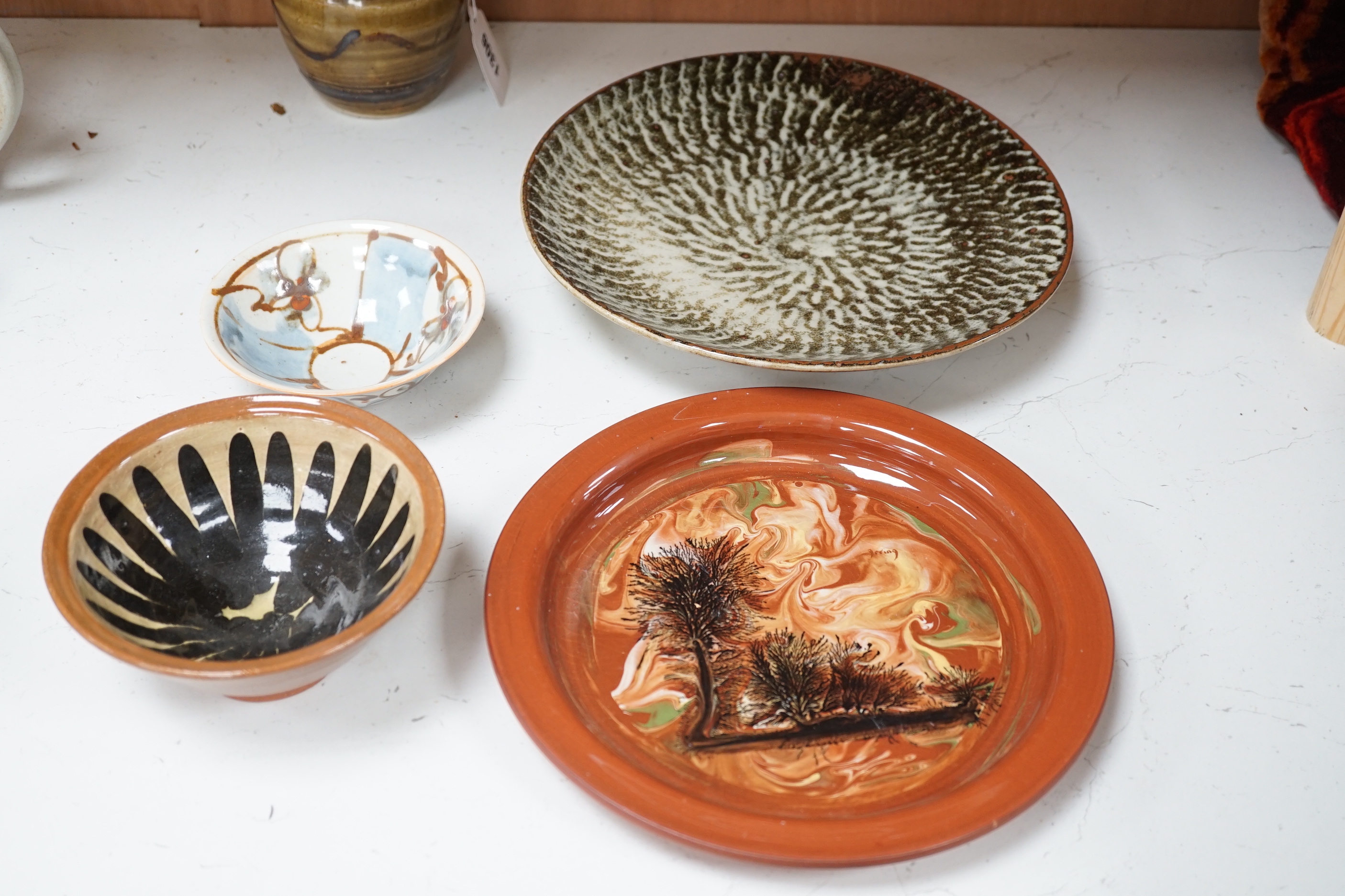 A group of European and Japanese studio pottery dishes, bowls and vases including a Boscastle R Irving plate, largest 26cm in diameter (17)